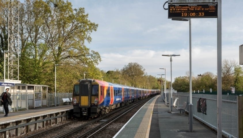A Great Western Railway train passes through Virginia Water station in Surrey, UK