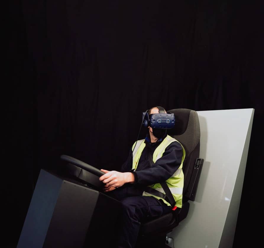 A man wearing a VR headset tests driverless technology at the Surrey Research Park.