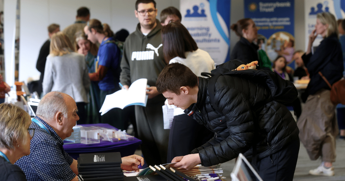 Surrey Transitions Fair 2026 | STEPSurrey | Surrey Careers Hub | attendees at the fair meet with exhibitors to find out about their options