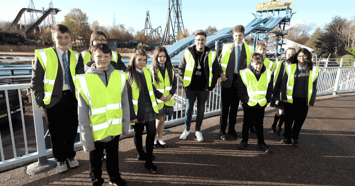 A group of students wear high vis jackets on their visit to Thorpe Park as part of their work experience | STEP Surrey | Surrey Careers Hub | Build your talent pipeline